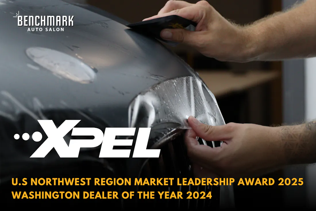 Technician installing XPEL paint protection film on vehicle