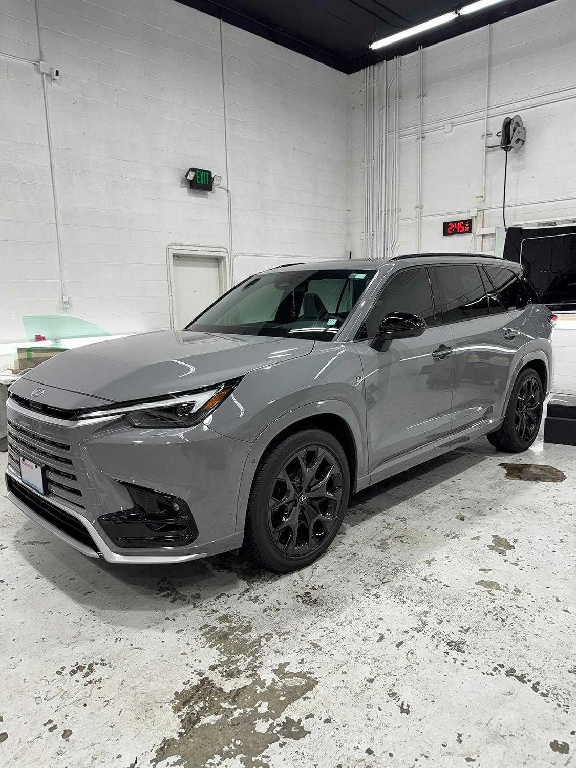 Grey Lexus TX SUV after paint protection service at Benchmark Auto Salon