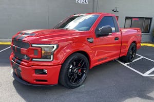 a red Shelby F-150 truck