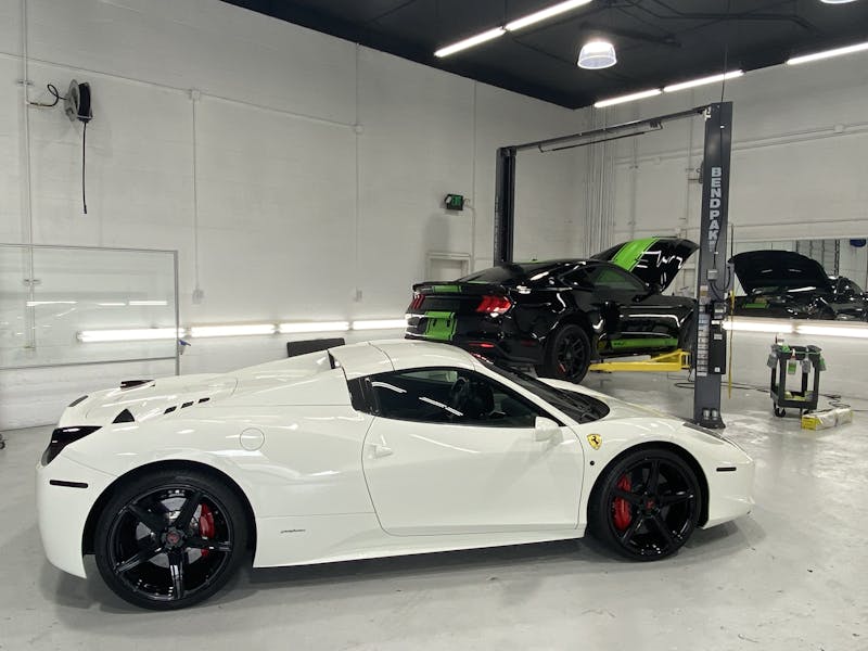 White Ferrari with Window Tint in an Auto Shop