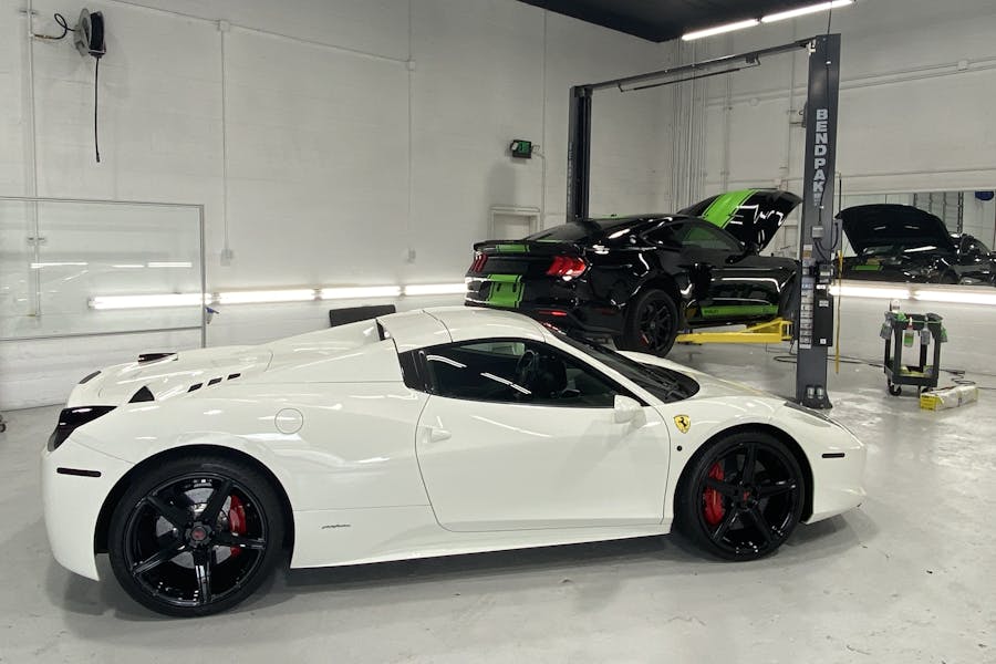 White Ferrari with Window Tint in an Auto Shop