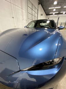 Custom paint coating on a blue car
