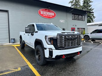 White GMC Sierra Denali HD at Benchmark Auto Salon in Lynnwood after paint protection film installation