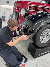 Installing paint protection film on the front fender of a restored vintage pickup truck