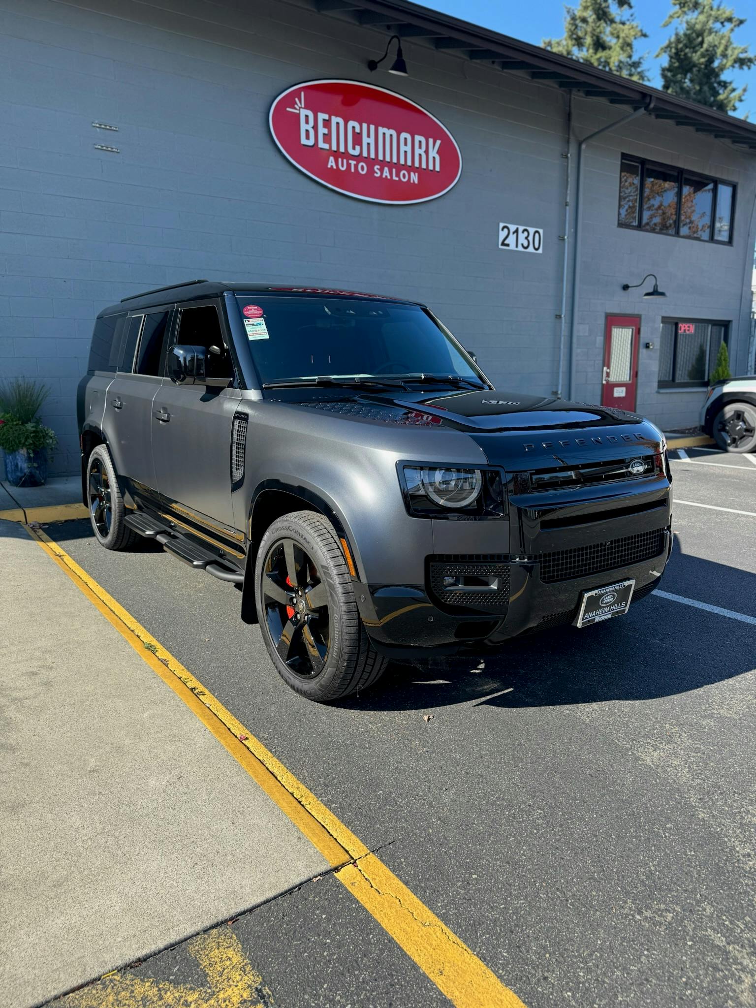 Land Rover Defender with XPEL STEALTH satin PPF outside our Lynnwood shop