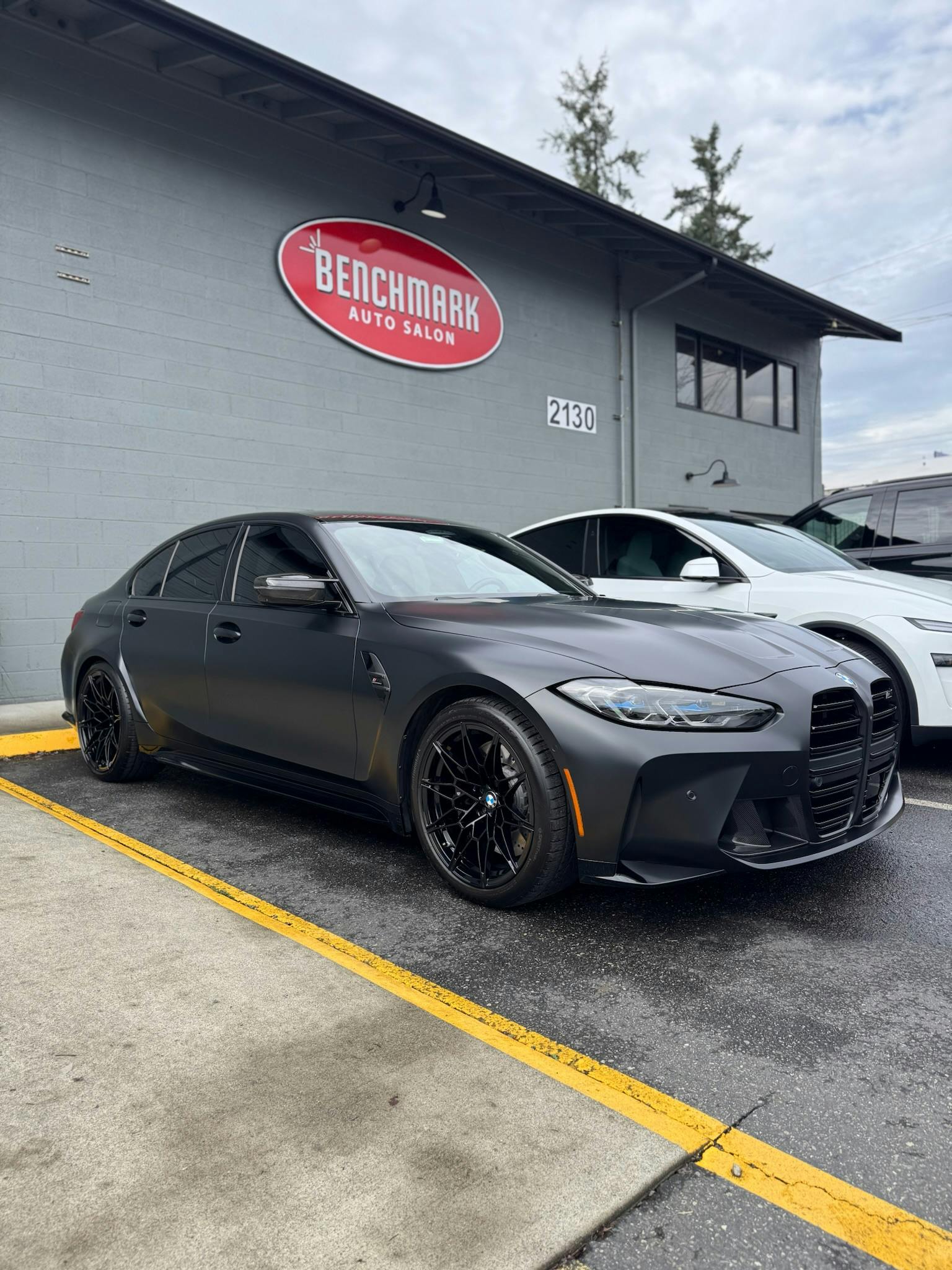 BMW M3 with full-body XPEL STEALTH satin PPF outside Benchmark Auto Salon