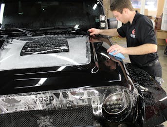 Jeep Wrangler in the process of having STEK dynoshield installed to the exterior