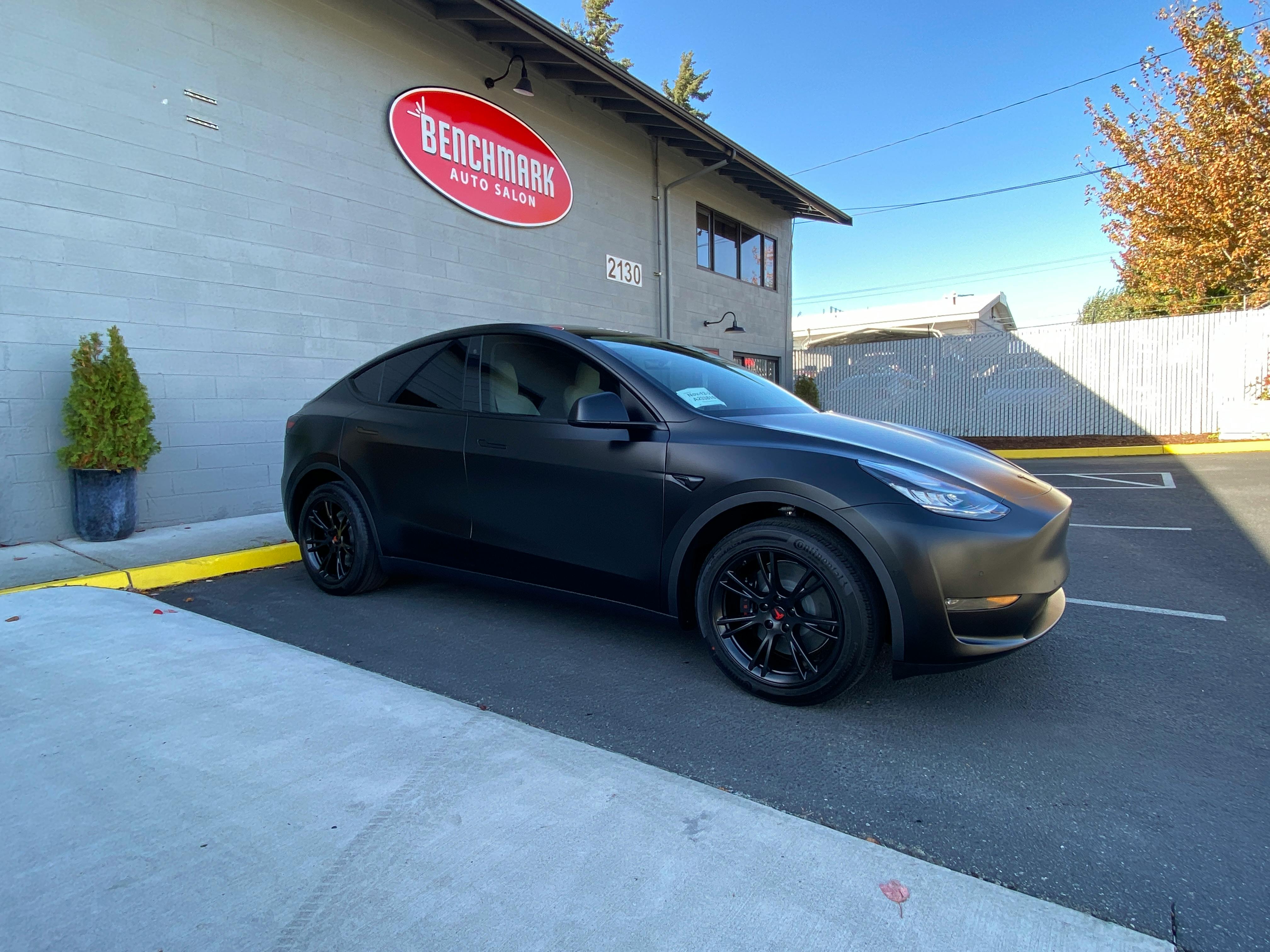 Satin black Tesla Model Y with ceramic window tint at Benchmark Auto Salon in Lynnwood